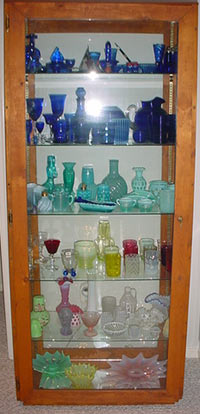 Etagere with Several Glass Collections