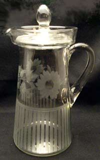 Unknown Pitcher with Lid and Floral Cutting